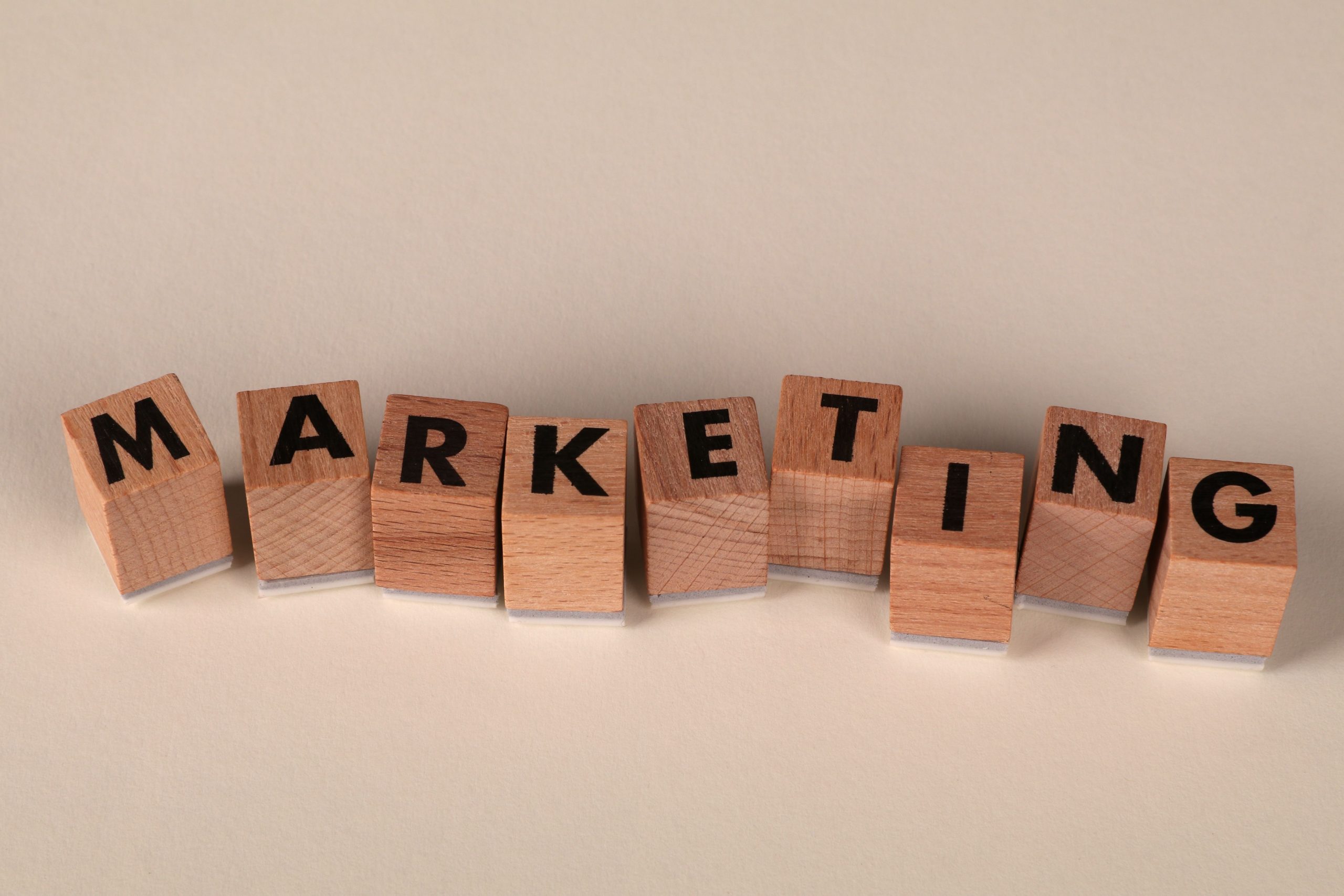 Wooden blocks with letters spelling 'marketing', ideal for business and advertising visuals.